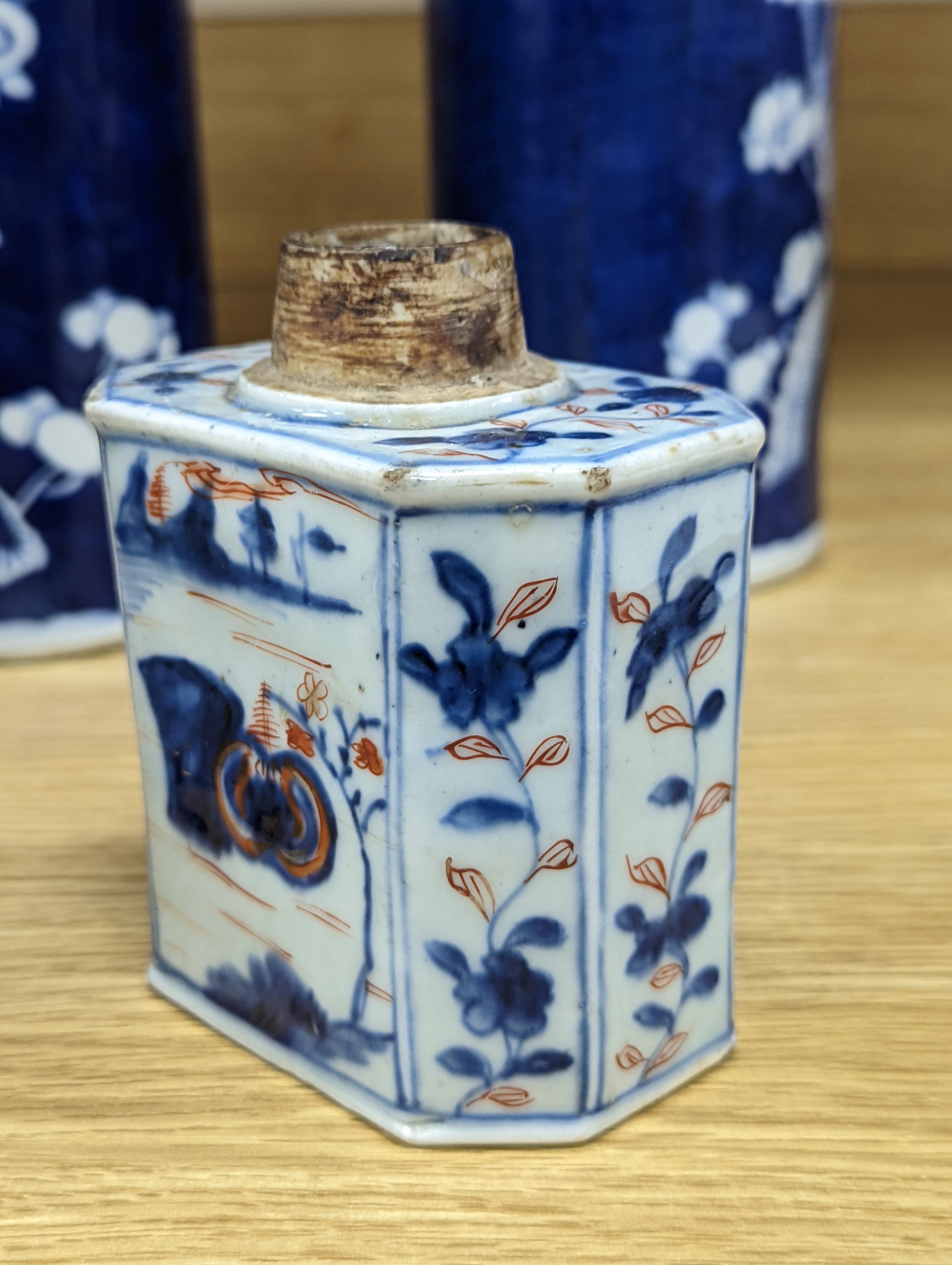 An 18th century Chinese famille rose mug, a Chinese Imari tea caddy and two Chinese blue and white sleeve vases 30cm (4)